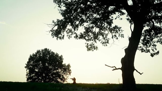 Hunter runs across the field and aim