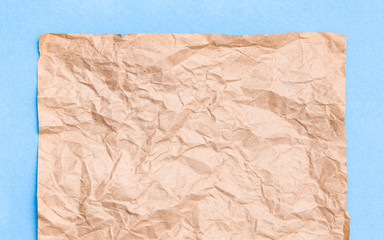 Brown craft texture sheet on blue frame bacground