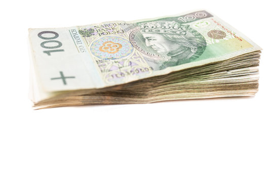 Bundle of banknotes on white isolated background arranged on a pile. Our savings for the future and retirement. Financial freedom by saving money. Collected money