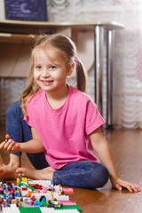 little children are playing with blocks happy girls at home funny lovely