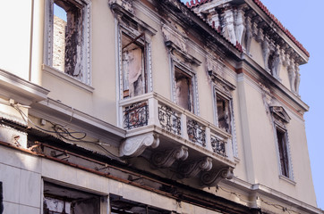 Classic building abandoned after fire burned windows and roof