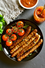 Fried sausage and cherry tomatoes