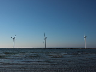 Line of Offshore Windmill Turbine at Sea