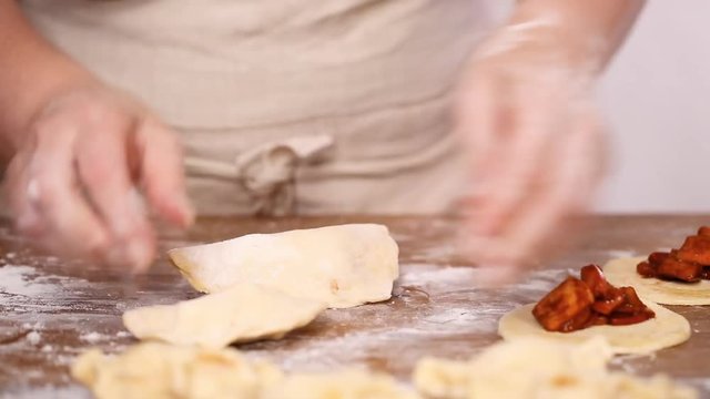 Step by step. Making home made empanadas with red apples fillings