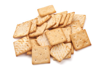 Salted cracker biscuit, close-up, isolated on white background.