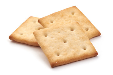 Salted cracker biscuit, close-up, isolated on white background.