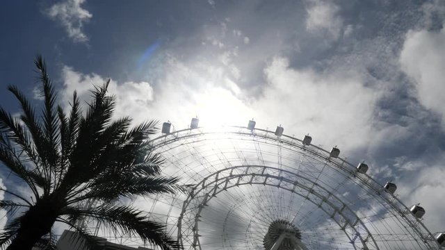 Orlando Eye Ferris Wheel In Amusement Park On Sunny Day