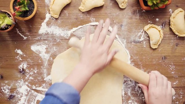 Flat lay. Step by step. Rolling dough for home made empanadas