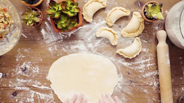 Flat lay. Step by step. Rolling dough for home made empanadas