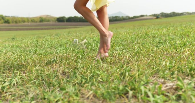 Woman Legs Walk Through Field