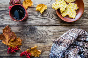 scarf and autumn leaves and red tea mug