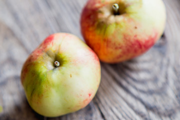two apples on a wood background
