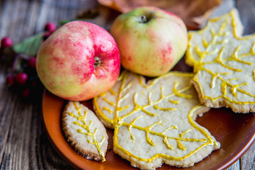 two red apples and autumn cookies