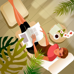 High angle view of a woman with a magazine lying on a lounge chair