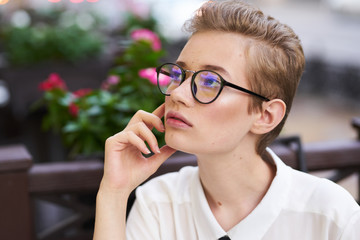 business woman with glasses on the veranda street