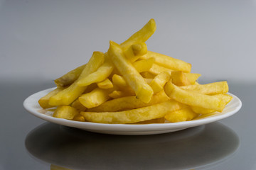 Potato fry or fries on dark background