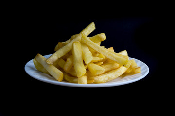 Potato fry or fries on dark background
