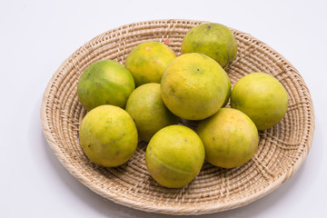Fresh green and yellow lime on white background.