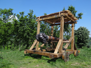 Medieval battering ram in park. Ancient weapon