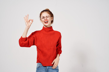 joyful woman with glasses marks fingers