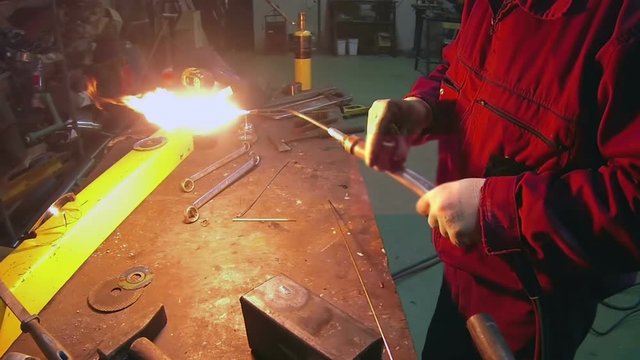 Welding Skills Training / Welder using oxygen acetylene torch for brazing and cutting during welding training in the workshop