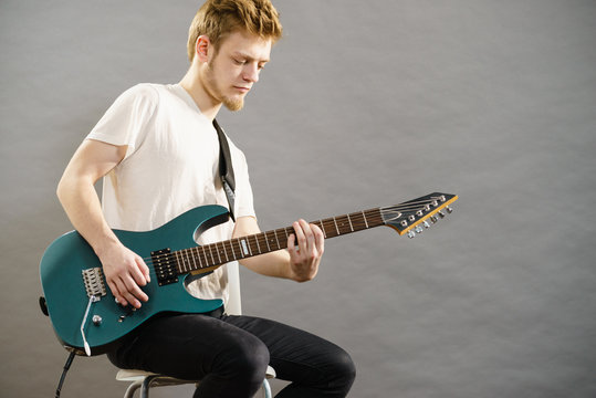 Man playing on electric guitar