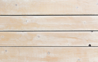 Pink wooden background or panel, texture, tinted. Close-up, side view.