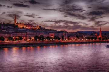 Fototapeta na wymiar View of Fisherman bastion in Budapest over Danube river at twilight