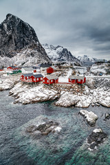 Hamnoy fishing village with red fishing huts (rorbu) in winter on Lofoten Islands, Reine, Norway. Travel Norway.