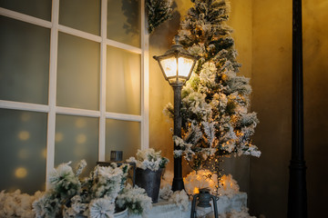 Photography studio with christmass decorations and vintage streetlamps