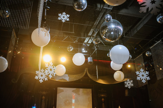 Party disco decorations with lights and christmass balls on the ceiling
