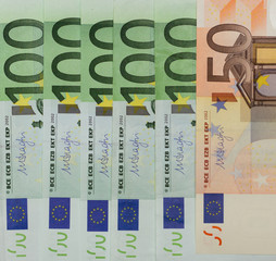 Money is a symbol of material wealth. European Union currency protection and recognition signs in close up view.