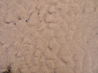 ripple marks in the sandy clay deposits, abstract background
