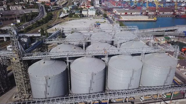 View from Above of the Grain Terminal in the Commercial Sea Port.In the Background you can see the Container Yard and Ships under Loading