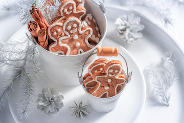 Delicious Christmas gingerbread man in white bucket