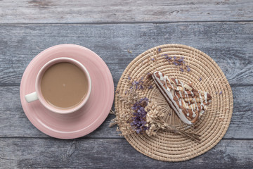 Chocolate with Macadamia-Almond cake Cake and hot coffee. on wooden table backgroynd