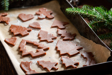 Tasty gingerbread cookies for Christmas on baking tray
