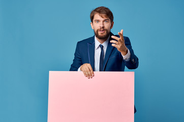 Business man with pink paper place free on a blue background