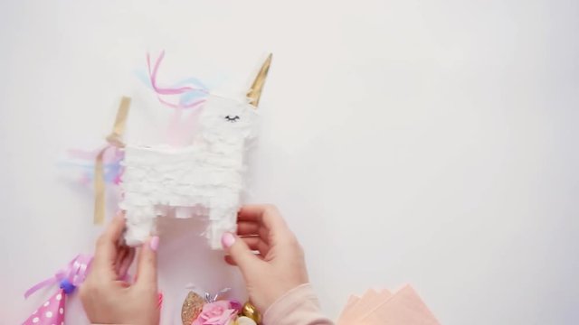 Small unicorn pinata on a white background