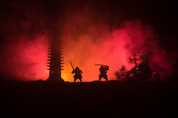 Samurai fighting concept. Silhouette of samurais in duel near tree and old temple. Picture with two...