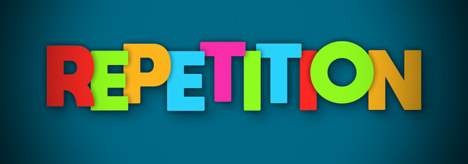 Repetition - overlapping multicolor letters written on blue background