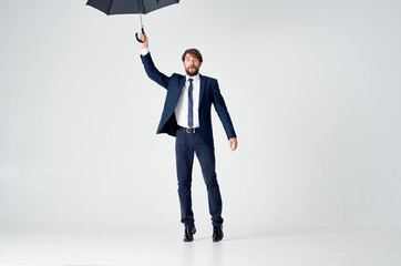 man with an open umbrella on an isolated background