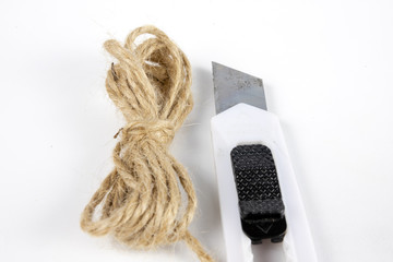 Twine for packaging parcels and a sharp knife. Cable for binding parcels sent by post.