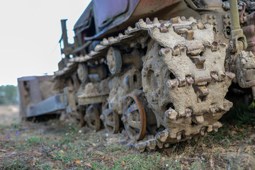 An old bulldozer for leveling the ground. Equipment for earthworks on a guarded field.
