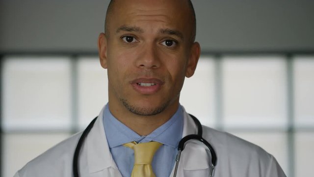 Doctor talking to the camera and giving bad news, in slow motion