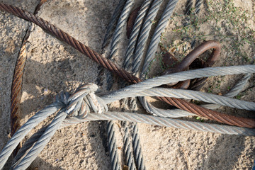 A steel rope on the sea coast. Cuma to fishing boats in central europe.
