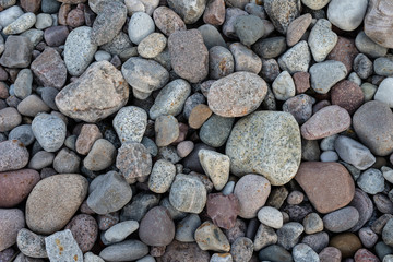 Colorful stones above the sea coast. Sea shore in central europe.