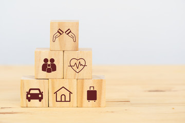 insurance concept, wooden cube symbolize put the insurance to protect or cover person, Property...