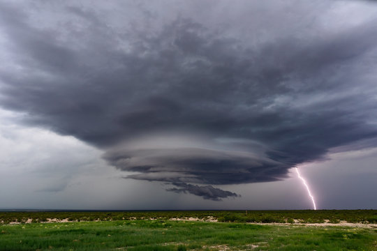 Supercell thunderstorm with dramatic clouds and lightning.