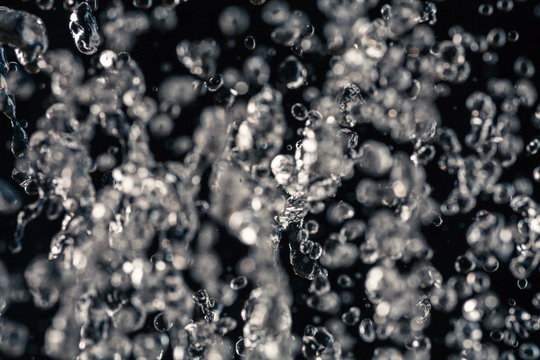 Half defocused half in focus water drops in an air
